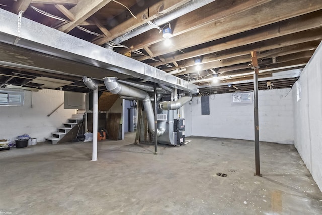 basement with electric panel and heating unit