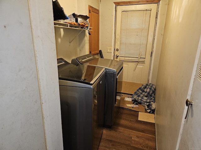 laundry area with dark hardwood / wood-style floors and separate washer and dryer