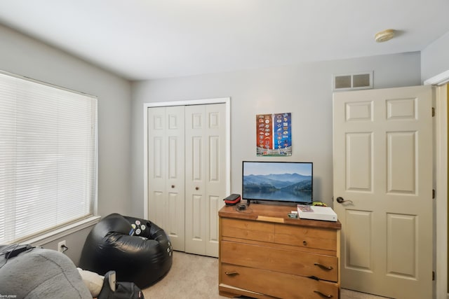 living area with light colored carpet