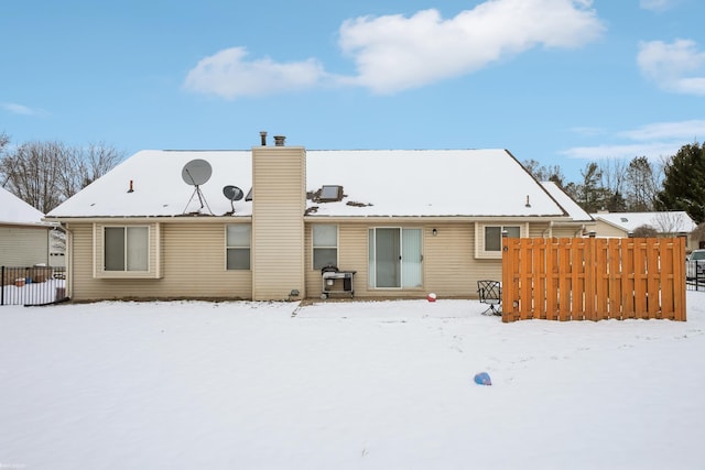 view of snow covered house