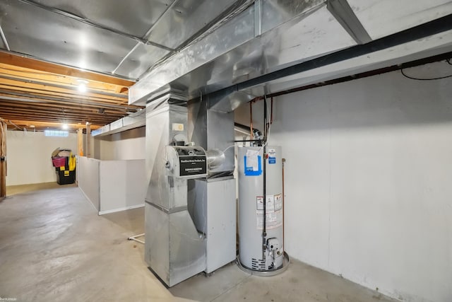 basement featuring gas water heater and heating unit