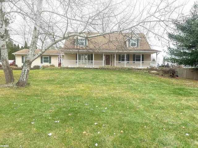 view of front facade with a front lawn and a porch