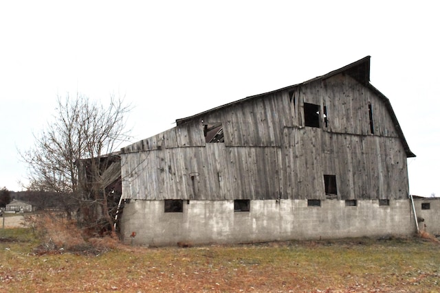 view of home's exterior with an outbuilding