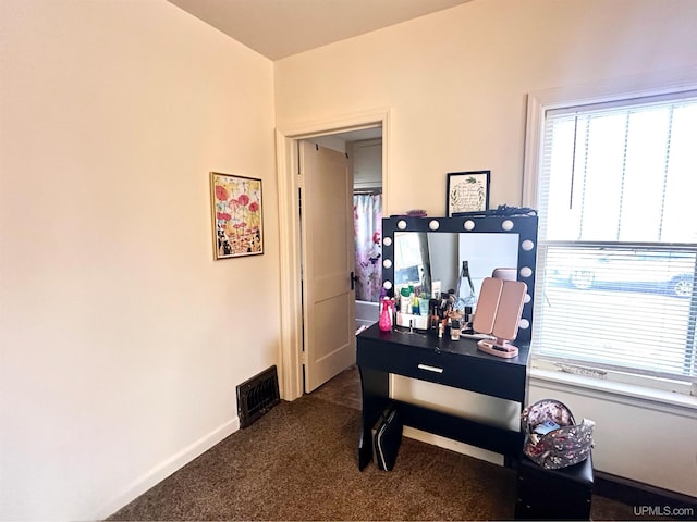 office area featuring dark colored carpet