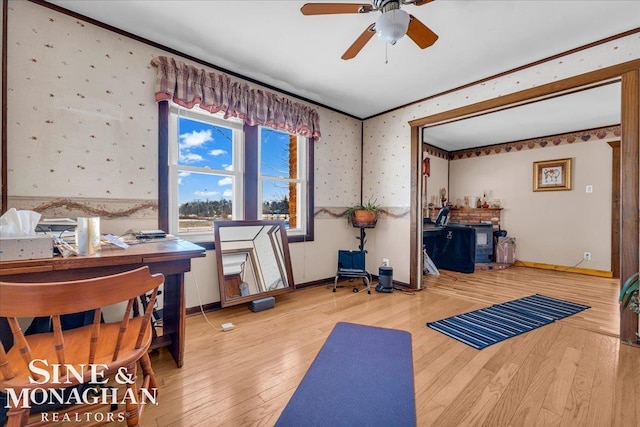 workout area featuring ceiling fan and wood-type flooring