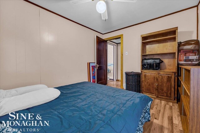 bedroom with ceiling fan, crown molding, and light hardwood / wood-style floors