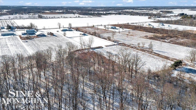 snowy aerial view with a rural view