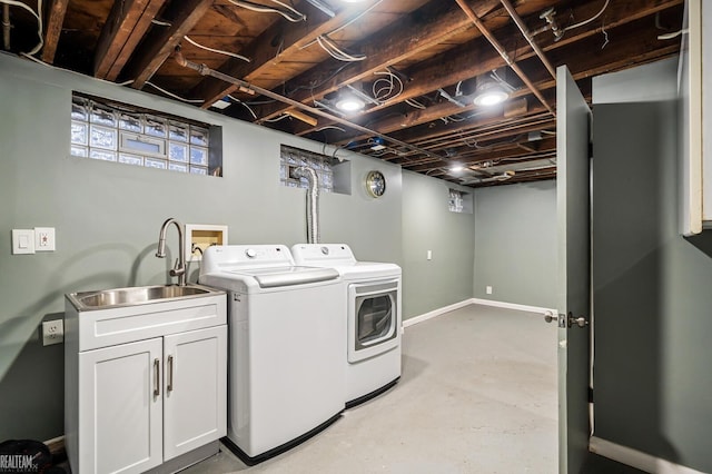 laundry area with sink and washing machine and clothes dryer