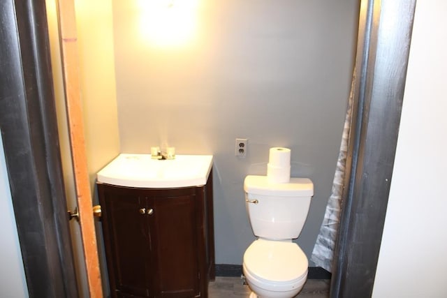 bathroom featuring vanity and toilet