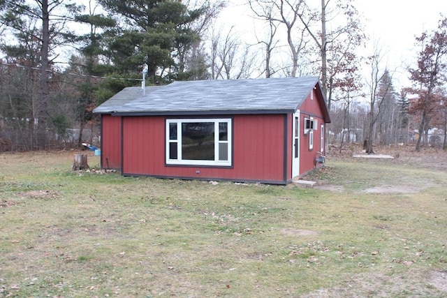 view of outdoor structure with a yard