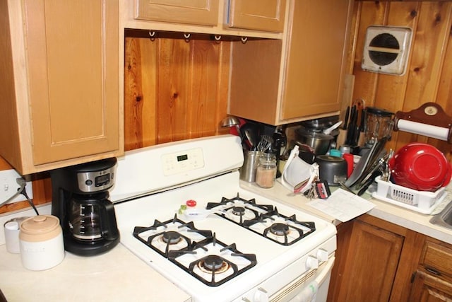 kitchen with white range with gas stovetop