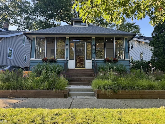 view of front facade featuring a sunroom