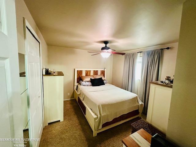 carpeted bedroom with ceiling fan