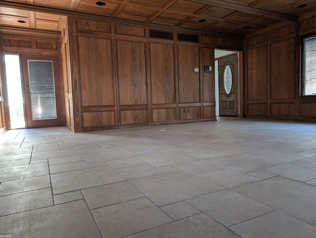 entryway with beamed ceiling, wood walls, wooden ceiling, and coffered ceiling