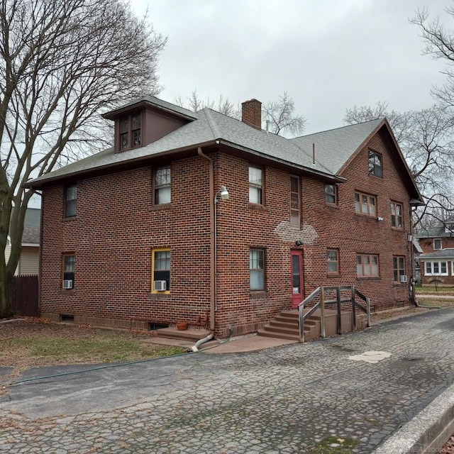 view of home's exterior with cooling unit