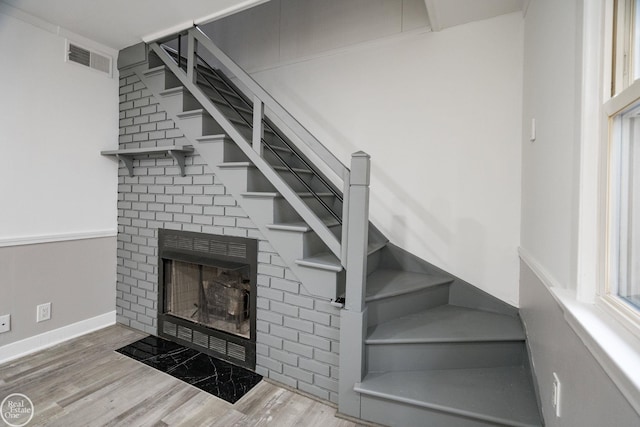 stairway with hardwood / wood-style flooring