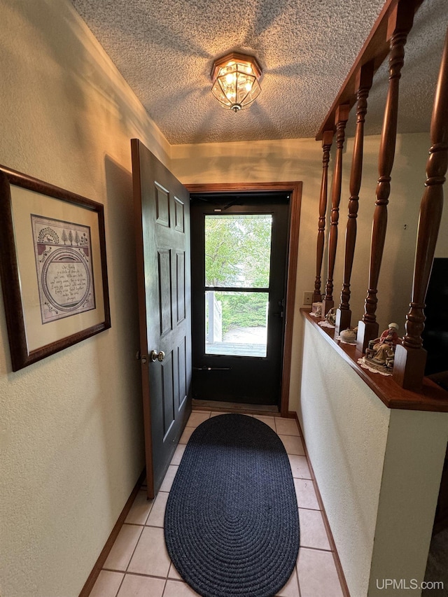 entryway with light tile patterned flooring