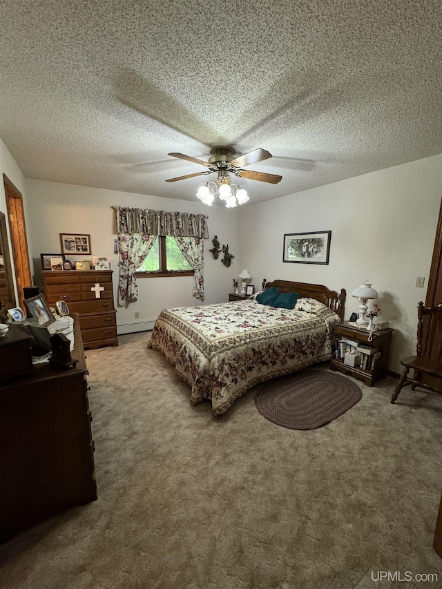 bedroom featuring carpet, a textured ceiling, baseboard heating, and ceiling fan