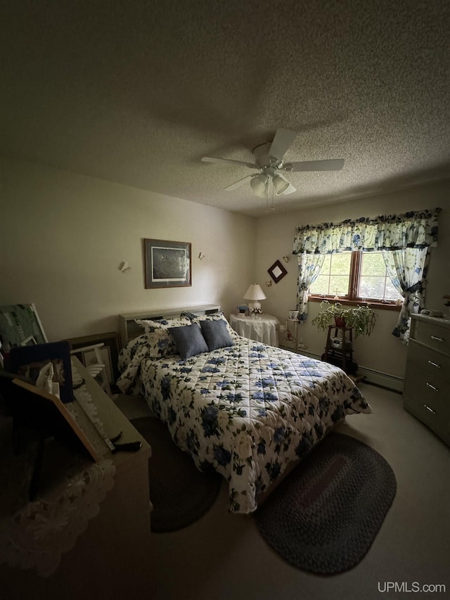 carpeted bedroom featuring ceiling fan, a baseboard radiator, and a textured ceiling