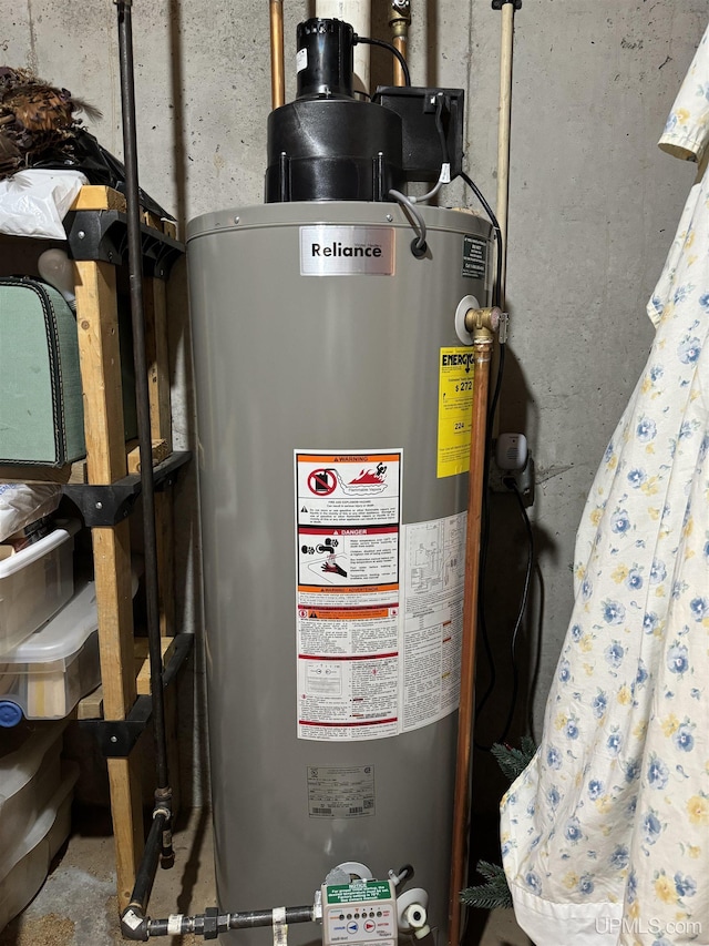 utility room featuring water heater