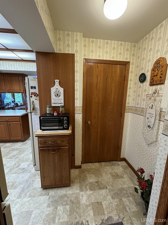 kitchen featuring white fridge