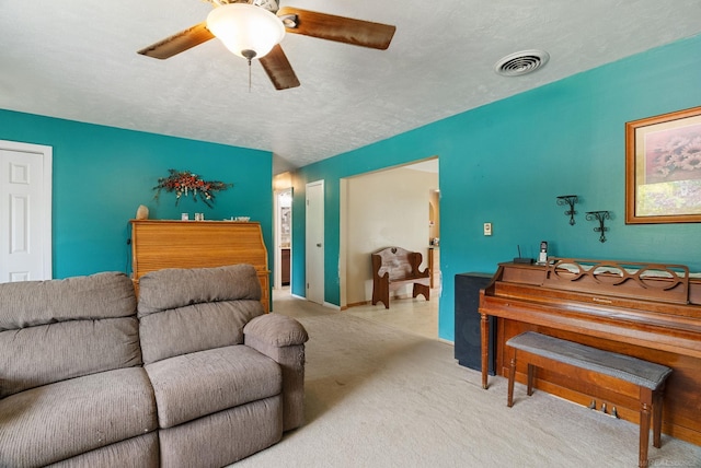 carpeted living room featuring a textured ceiling