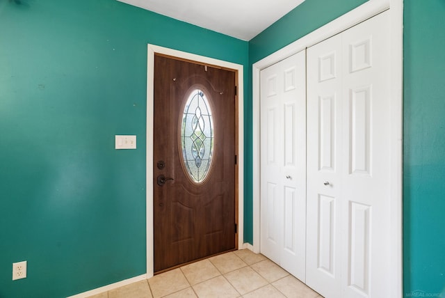 entryway with light tile patterned floors