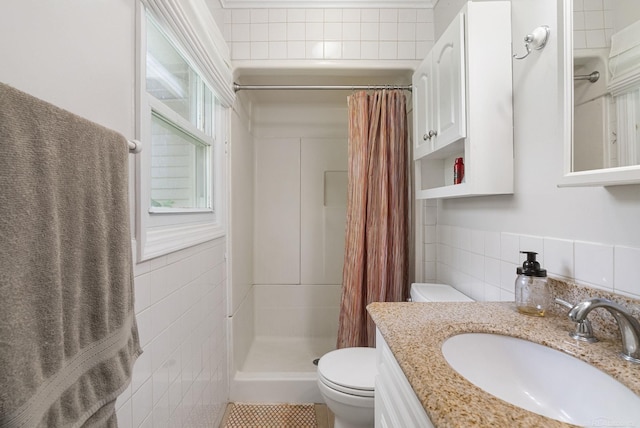 bathroom featuring a shower with shower curtain, vanity, toilet, and tile walls