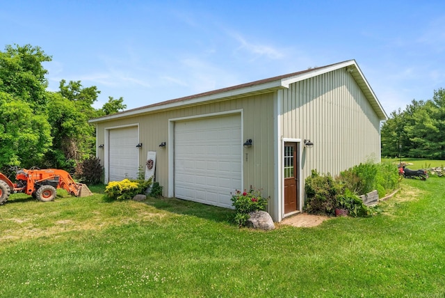 garage featuring a yard