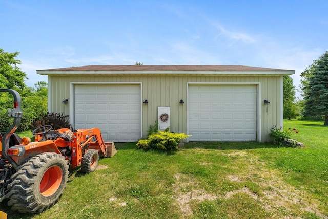 garage featuring a lawn