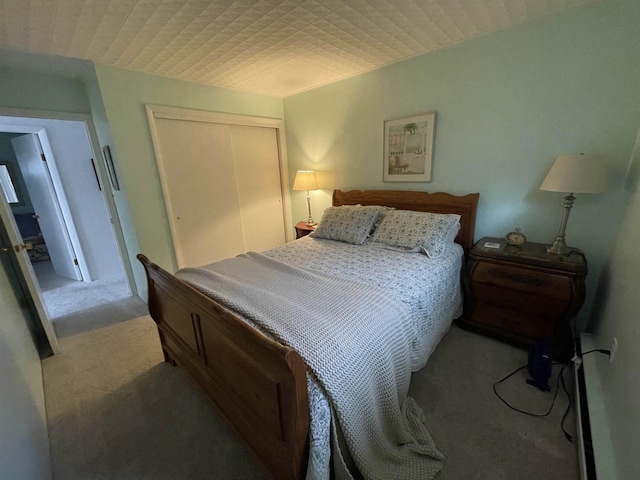 carpeted bedroom with a closet