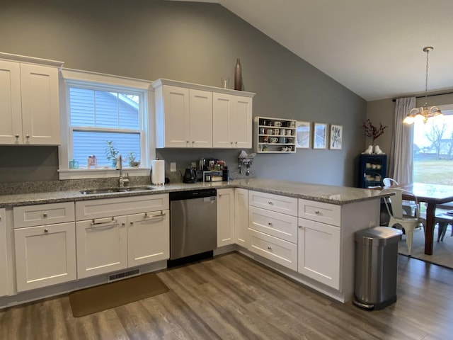 kitchen with dishwasher, kitchen peninsula, white cabinets, and sink