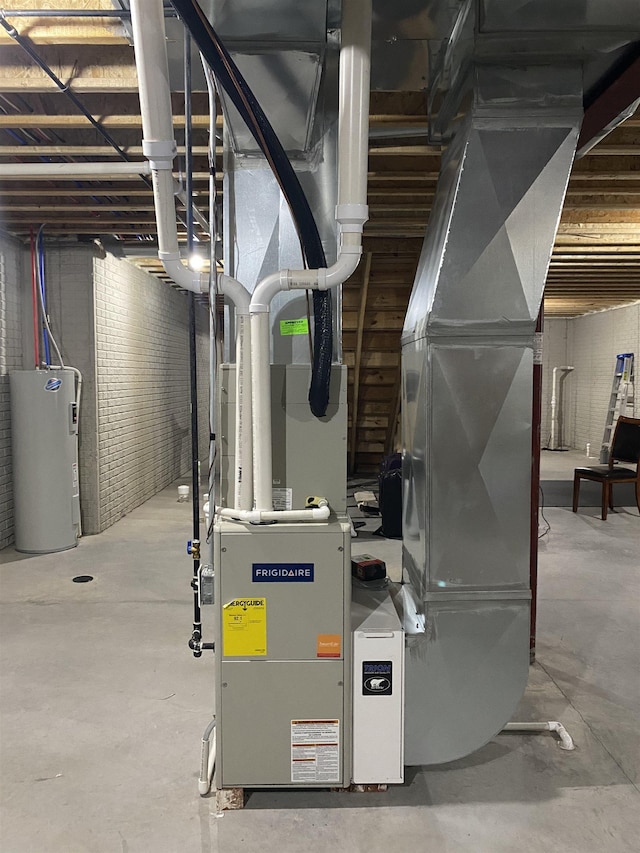 utility room with electric water heater