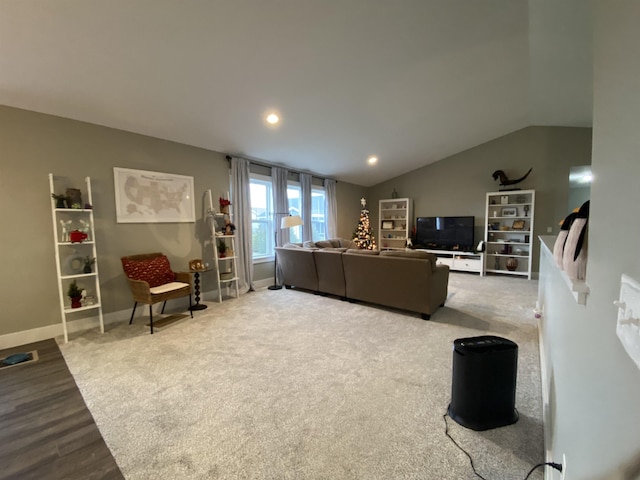 living room with wood-type flooring and vaulted ceiling