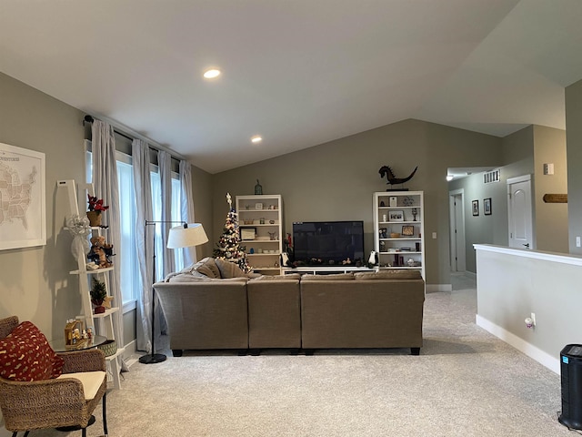 living room featuring light colored carpet and vaulted ceiling