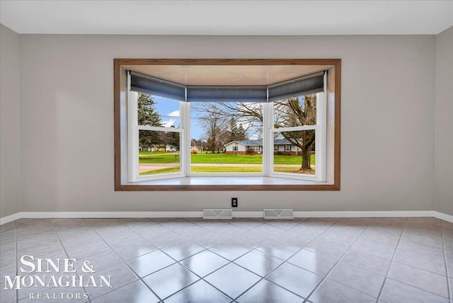 unfurnished dining area with light tile patterned floors