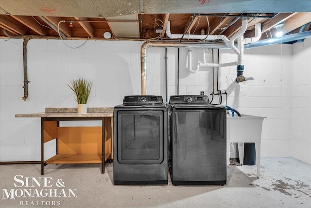 clothes washing area with independent washer and dryer