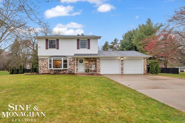 view of property featuring a front yard and a garage