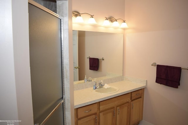 bathroom with vanity and walk in shower