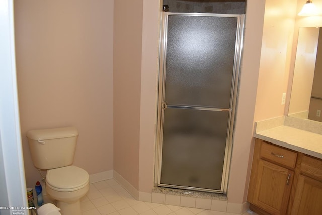 bathroom featuring walk in shower, tile patterned floors, vanity, and toilet