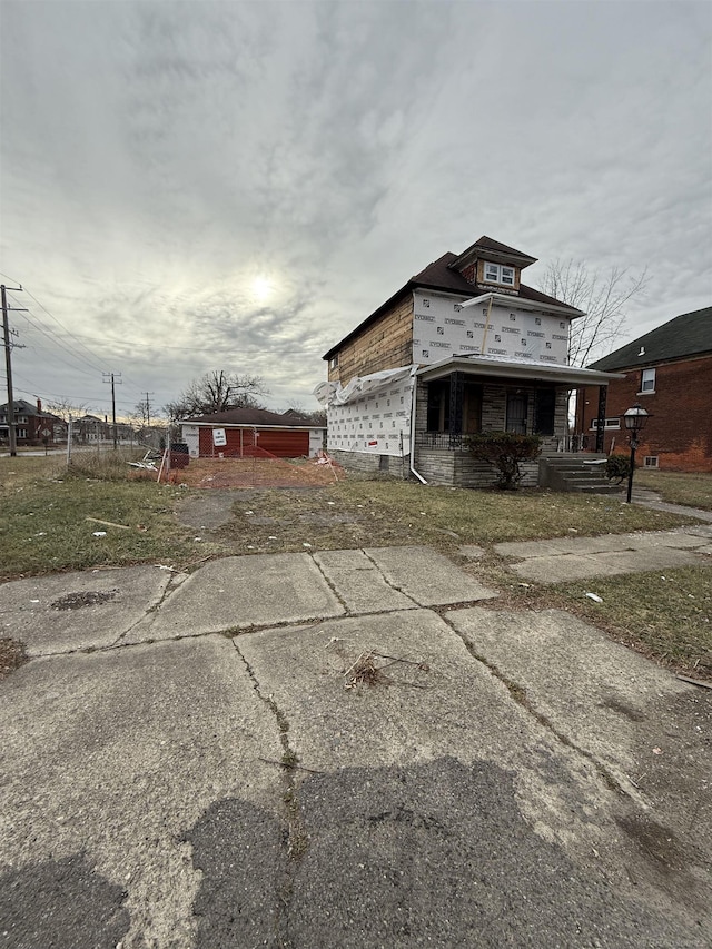 view of side of property with a porch