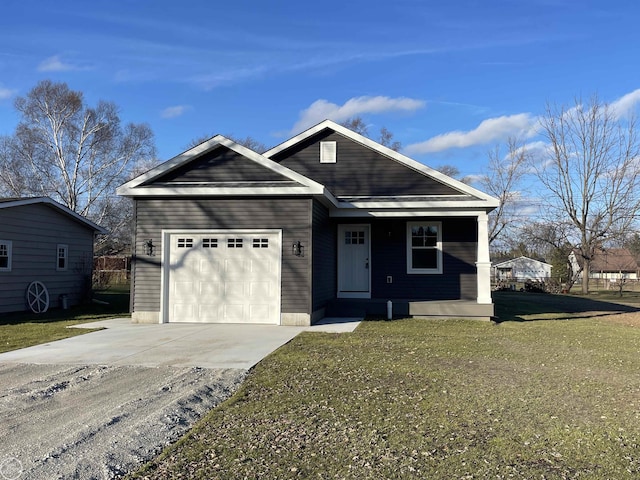 view of front of house with a front yard and a garage