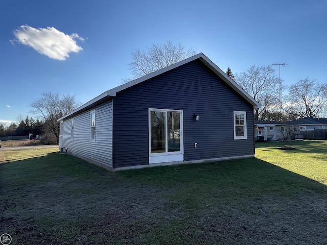 rear view of house with a yard