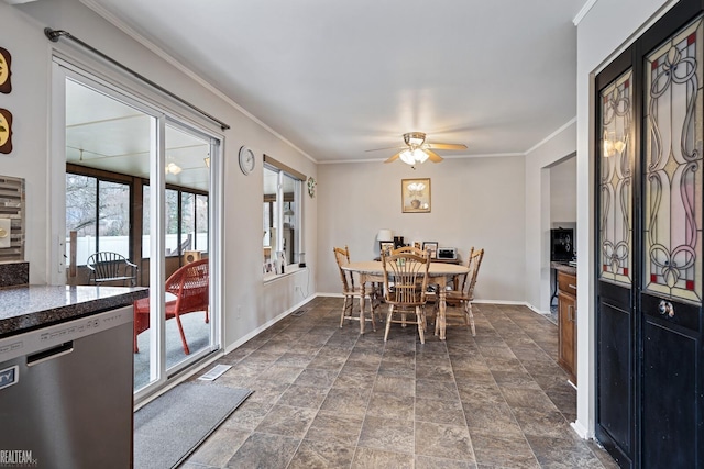 dining area featuring a wealth of natural light, ceiling fan, and crown molding