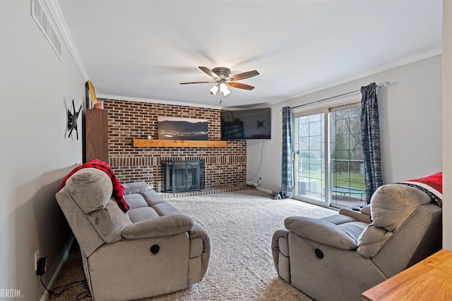 living room featuring ceiling fan, a fireplace, carpet, and ornamental molding