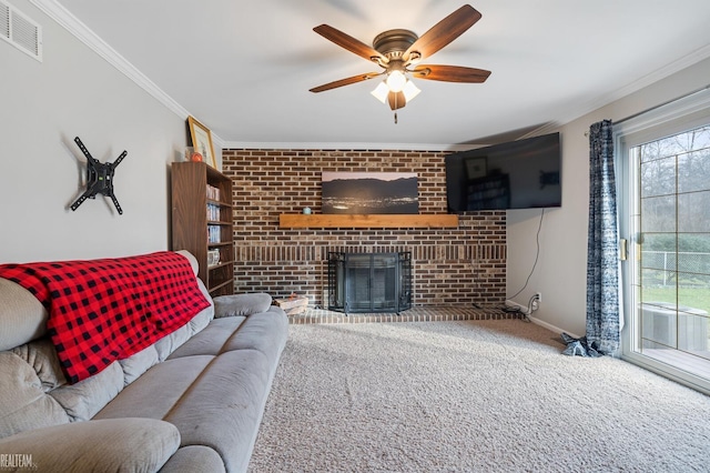 living room with ceiling fan, carpet floors, ornamental molding, and a brick fireplace