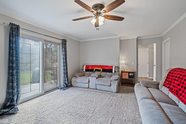 living room with carpet, ceiling fan, and ornamental molding