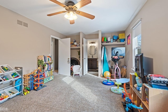 rec room featuring carpet flooring and ceiling fan