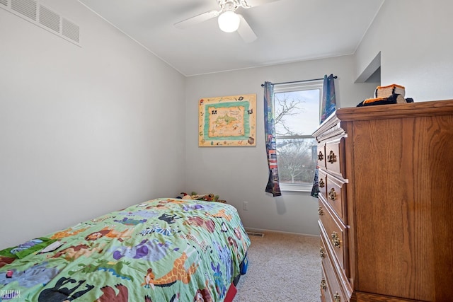 bedroom with ceiling fan and light colored carpet