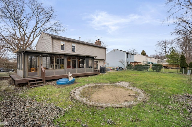 back of house with a lawn